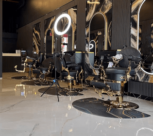 Barber cutting hair at Iconic Fades